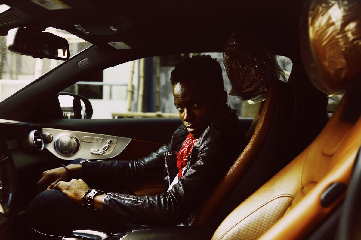 Driver seated in a car in Abuja